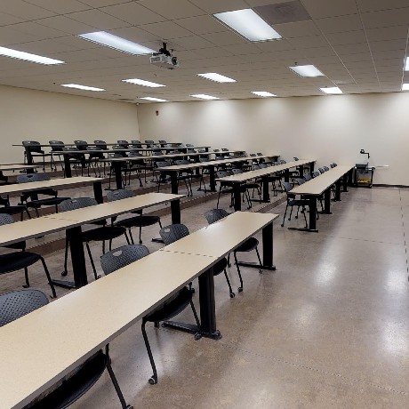 SLB classroom - View of tiered classroom with long tables and chairs